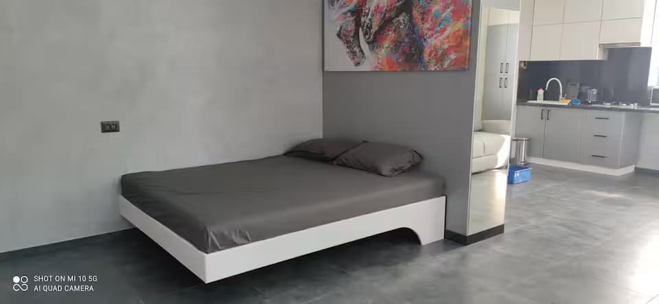 A sparse apartment interior that feels more like a staged rental than a lived-in home